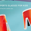 A pair of orange and white polarized sports sunglasses for kids displayed against a light blue background.