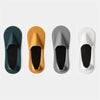 Four pairs of men's invisible boat socks in dark green, gold, gray, and white shown from the top view.