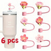 Six pink silicone straw covers for tumblers and water bottles shown with a full tumbler.