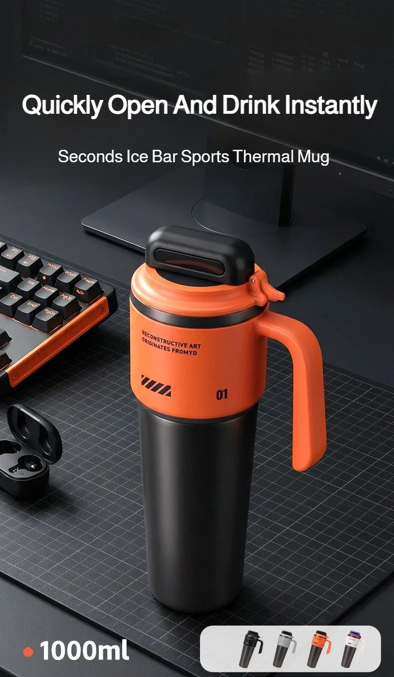 An orange insulated thermal mug with a black lid and handle is shown on a dark surface.