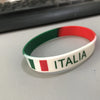 A white silicone wristband with the Italian flag colors (green, white, red) and the word ITALIA printed on it.