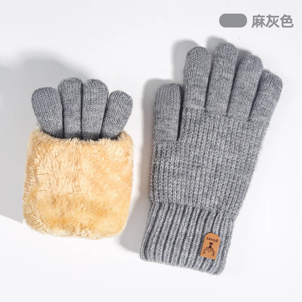 Gray knit thermal gloves with a fluffy tan lining and touchscreen functionality