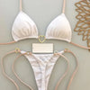A white halter bikini set with thin pink straps displayed against a light background.