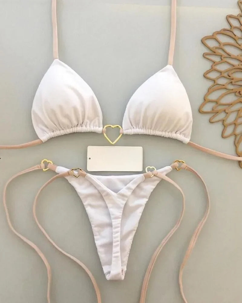 A white halter bikini set for women displayed against a light background.