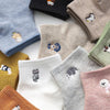 A collection of pastel and earthy colored cotton socks featuring various kawaii embroidered animal designs.