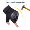 Black tactical five-finger gloves with hard shell protection shown next to a hammer.