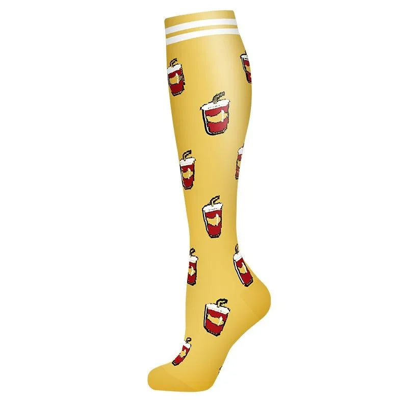 Yellow compression socks with red chili pepper designs for circulation and support