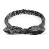 Black paisley elastic hair headband with intricate white patterns