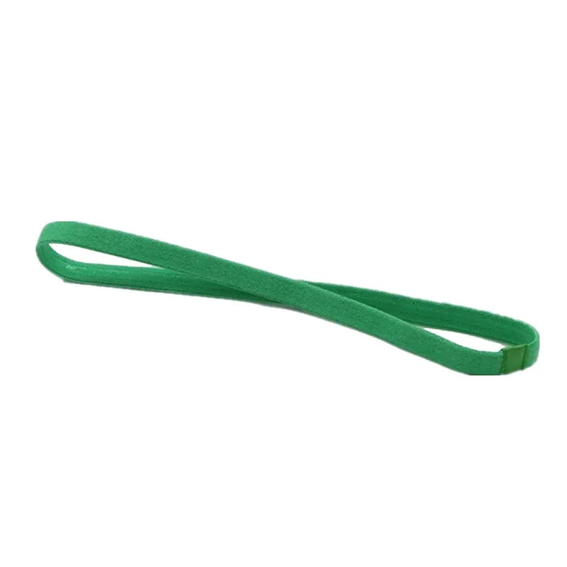 A green elastic sports headband is shown stretched out.