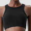 Black ribbed high-impact stretch yoga crop top worn by a model.