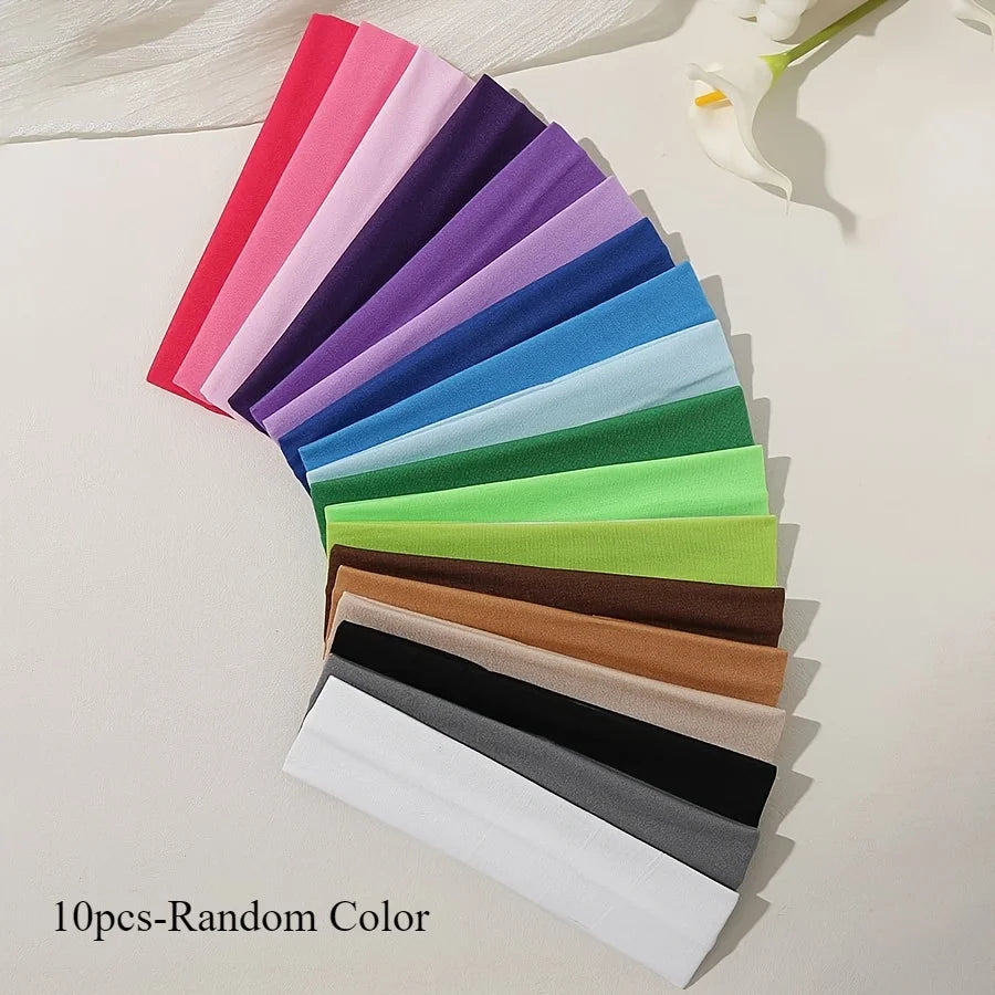 A fan arrangement of 10 colorful anti-slip elastic headbands displayed on a white surface.