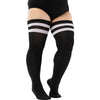 Black striped thigh high leg warmers worn on a person's leg.