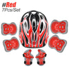 A set of red and black protective gear including a helmet, knee pads, and wrist guards for kids.