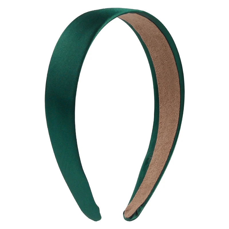 A pair of solid satin hair bands in dark green and brown.