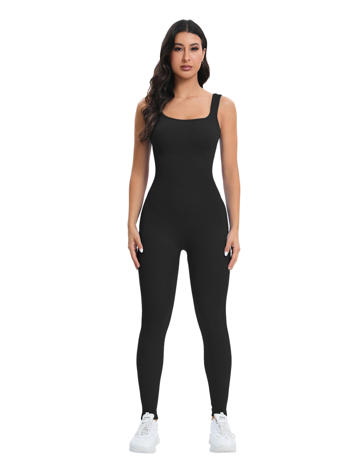 A woman models a black ribbed nylon bodycon jumpsuit with white sneakers.