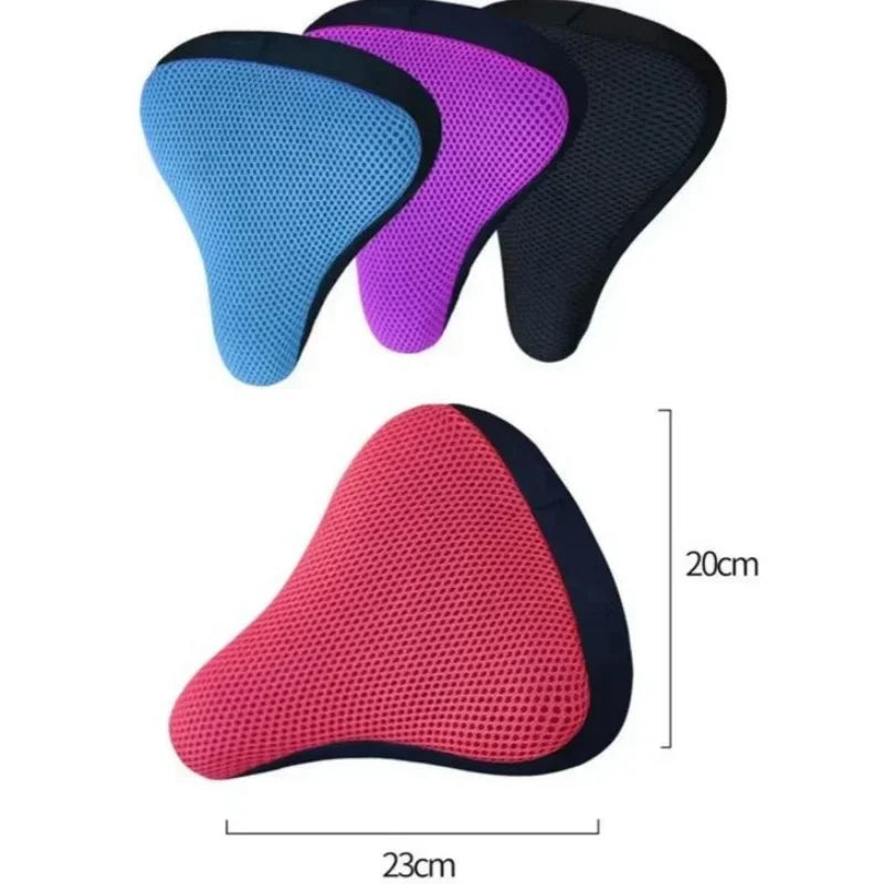 A set of four breathable 3D mesh bicycle saddle cushions in blue, purple, black, and pink.