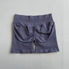 A pair of seamless high-waisted yoga shorts in a solid gray color.
