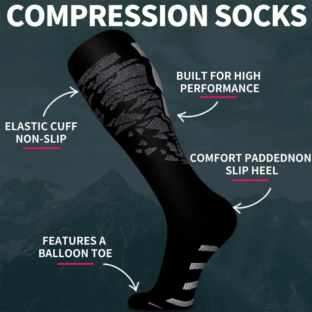 A close-up view of black compression socks with elastic cuffs and a balloon toe, designed for high performance.