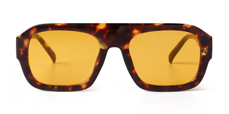 Vintage oversized square sunglasses with a tortoiseshell pattern frame and yellow-tinted lenses.