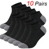 A stack of ten pairs of black and gray ankle socks displayed on a white background.