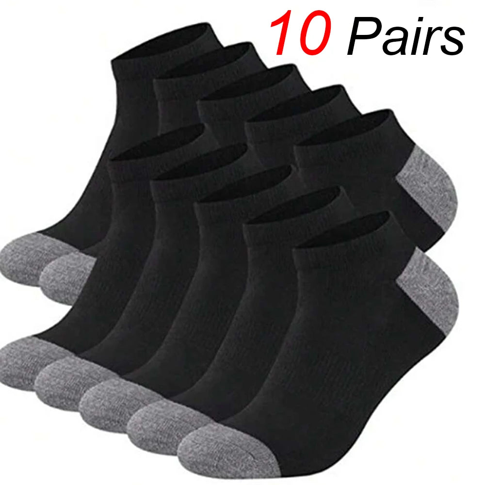 A stack of ten pairs of black and gray ankle socks displayed on a white background.