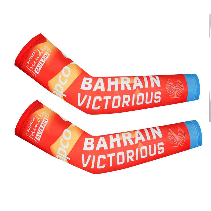 Two cycling arm warmers featuring the Bahrain flag design and victorious text