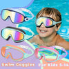 A young boy is smiling while wearing various colored swim goggles for kids.