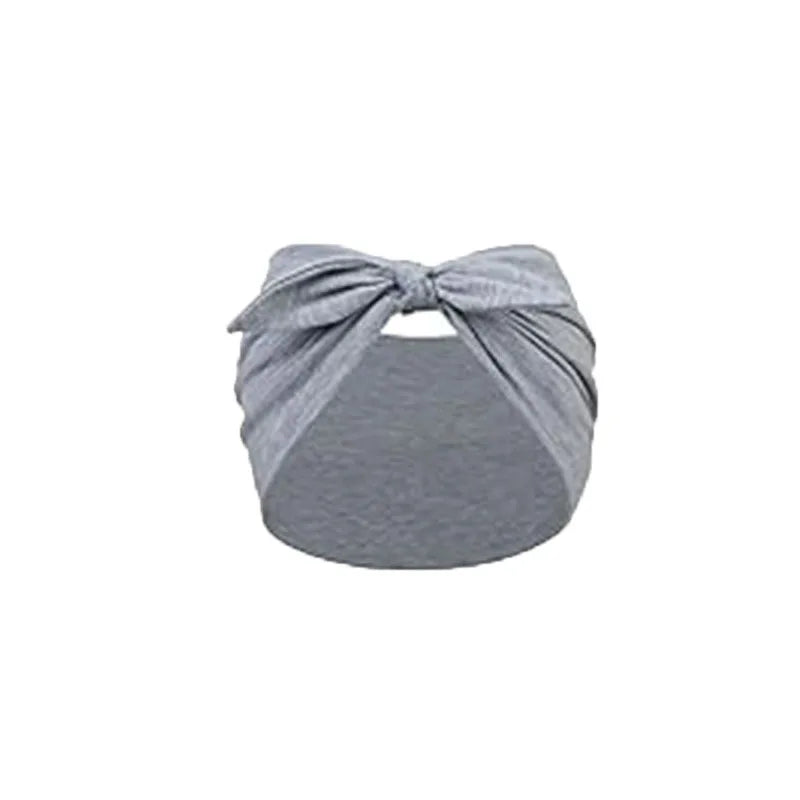 A gray solid bow headband for hair styling and workout.