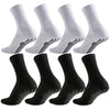 A set of white and black athletic grip socks shown from the side.