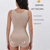 A woman models a beige zippered shapewear bodysuit designed to lift the hips and provide waist slimming.