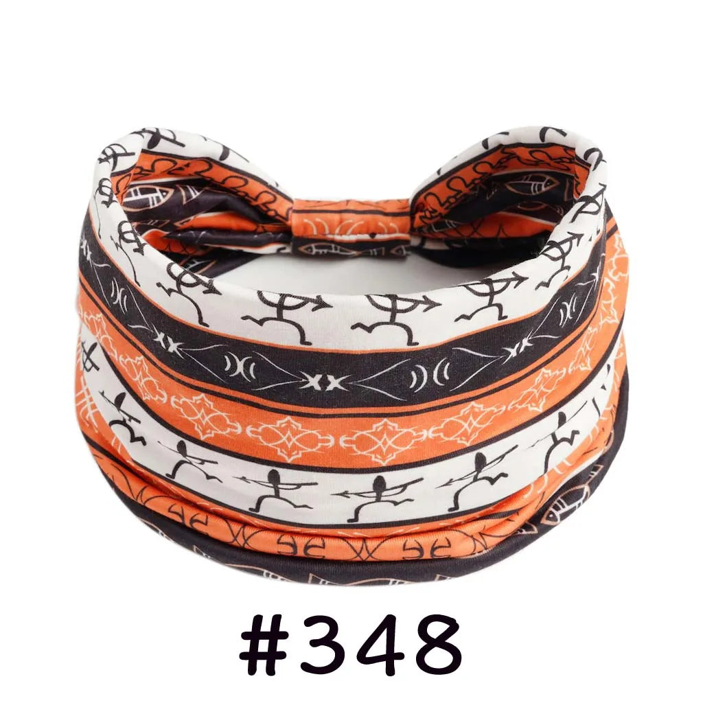 Boho knotted cotton headband in orange and black geometric print