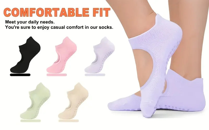 A variety of comfortable fit non-slip socks in black, pink, white, and light green are shown next to a purple sock being worn