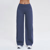 A pair of dark blue high-waist flared yoga pants worn by a person.