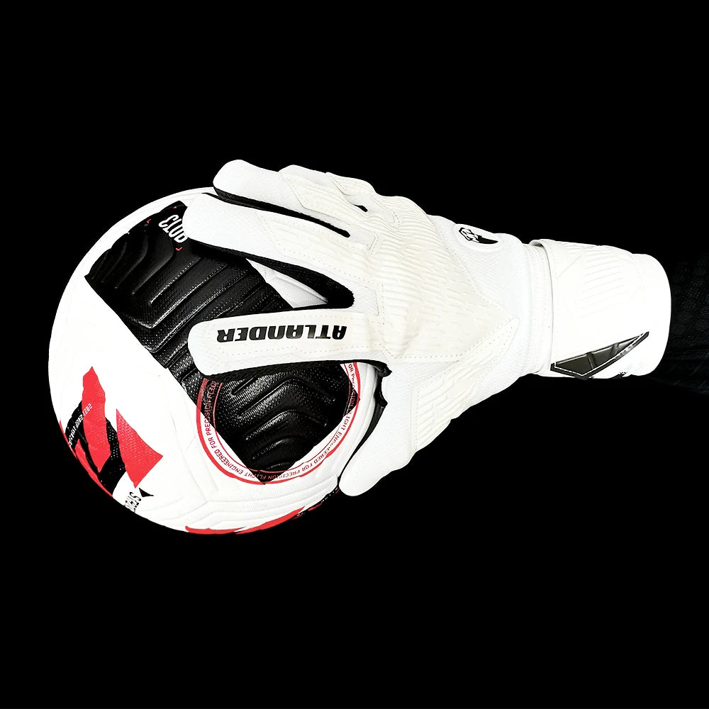 White latex goalkeeper gloves with black accents and wrist strap shown against a black background.