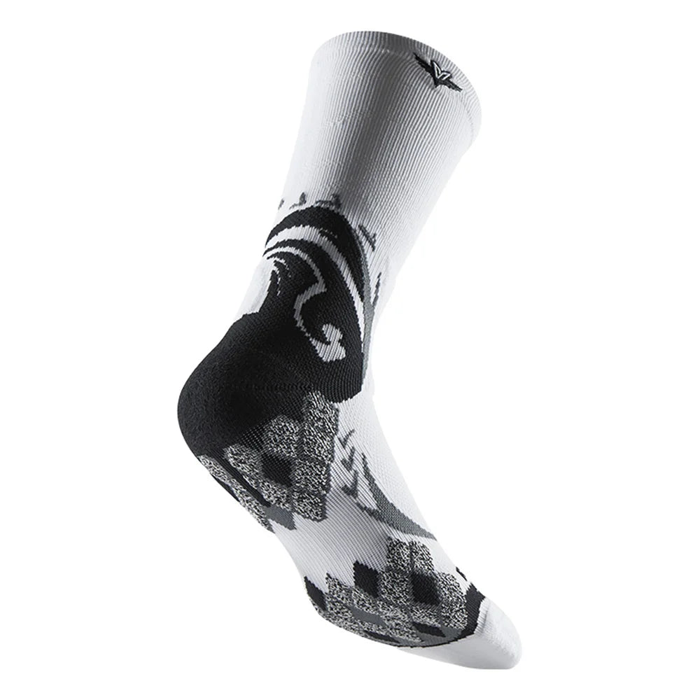 A close-up view of a white athletic sock with a black and gray camouflage pattern.