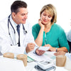 A doctor and a patient review athletic binding tape for sports injury support on a table.