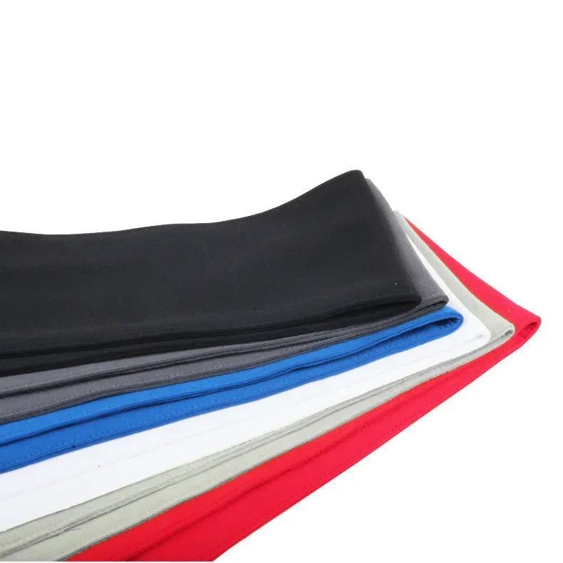 A stack of breathable sports headbands in black, gray, blue, white, and red.