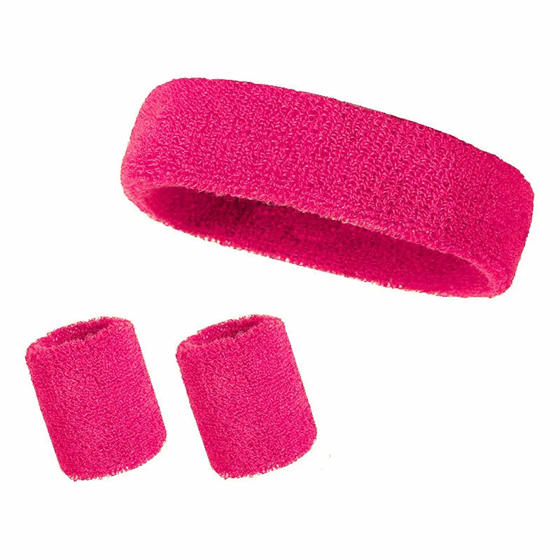 A set of three bright pink athletic sweatbands or hairbands.
