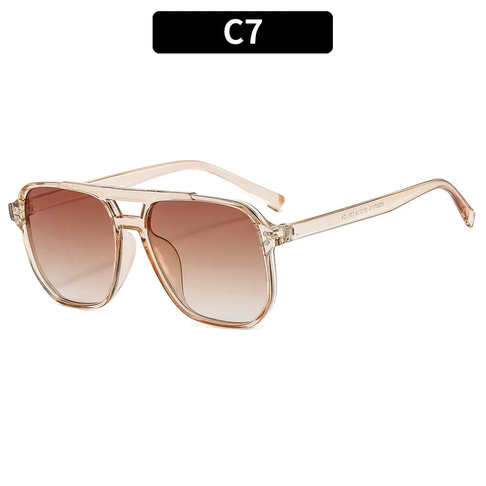 Vintage square sunglasses with a double bridge in a rose gold frame and tinted lenses.