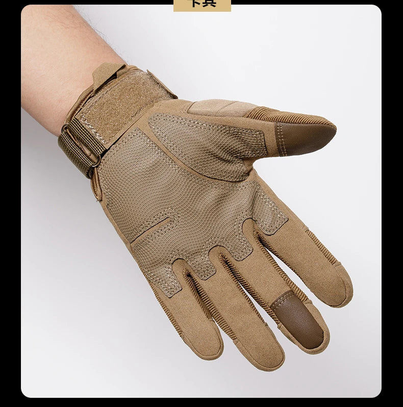 A close-up of tactical full finger gloves in a tan or olive color being worn on a hand.