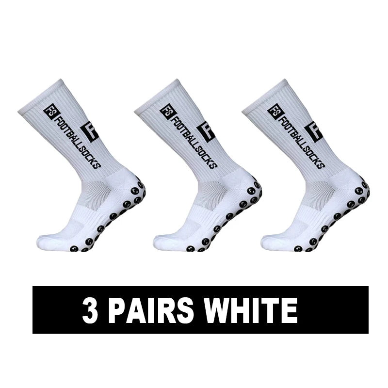 Three pairs of white anti-slip silicone grip football socks displayed diagonally.