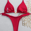 A red tie-side bikini set featuring a triangle top and matching bottoms, displayed against a light gray background.