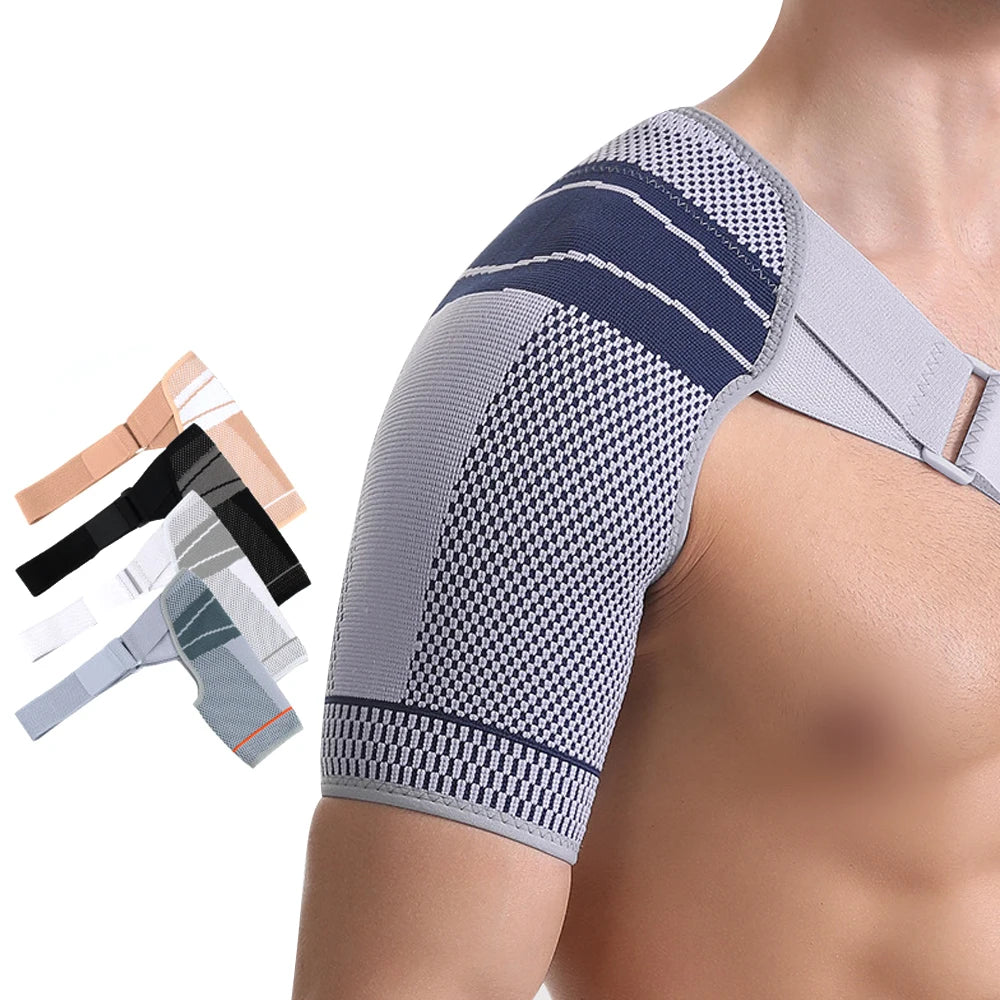A close-up of a gray adjustable shoulder support brace for rotator cuff relief worn on a person's arm.