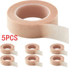 Five rolls of pink eyelash extension tape for precision application