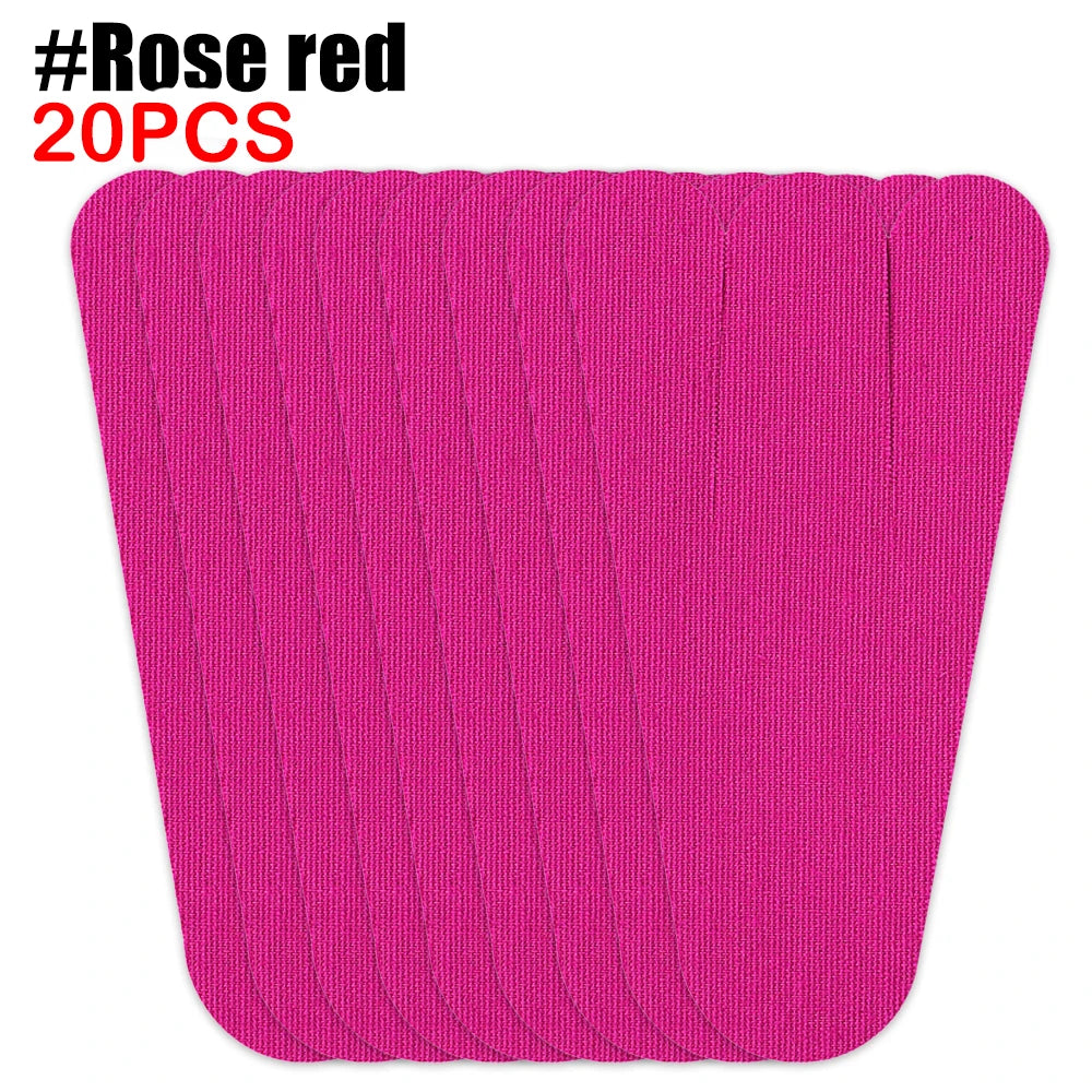 A stack of bright pink kinesiology tape strips for foot and joint support.