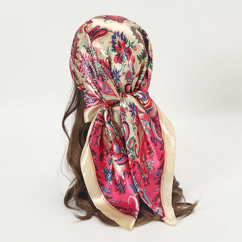 Elegant satin square scarf featuring a floral pattern in pink and green for hijab and hair