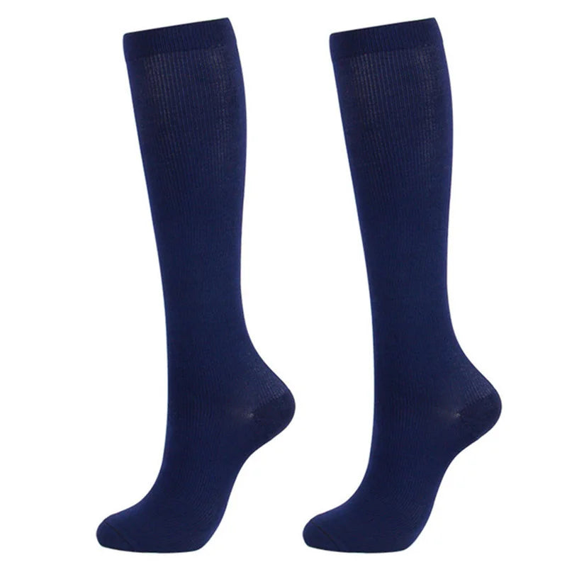 A pair of navy blue medical grade compression socks for veins and circulation.