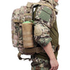A close-up of a tactical MOLLE water bottle pouch attached to a green military-style shirt and backpack.