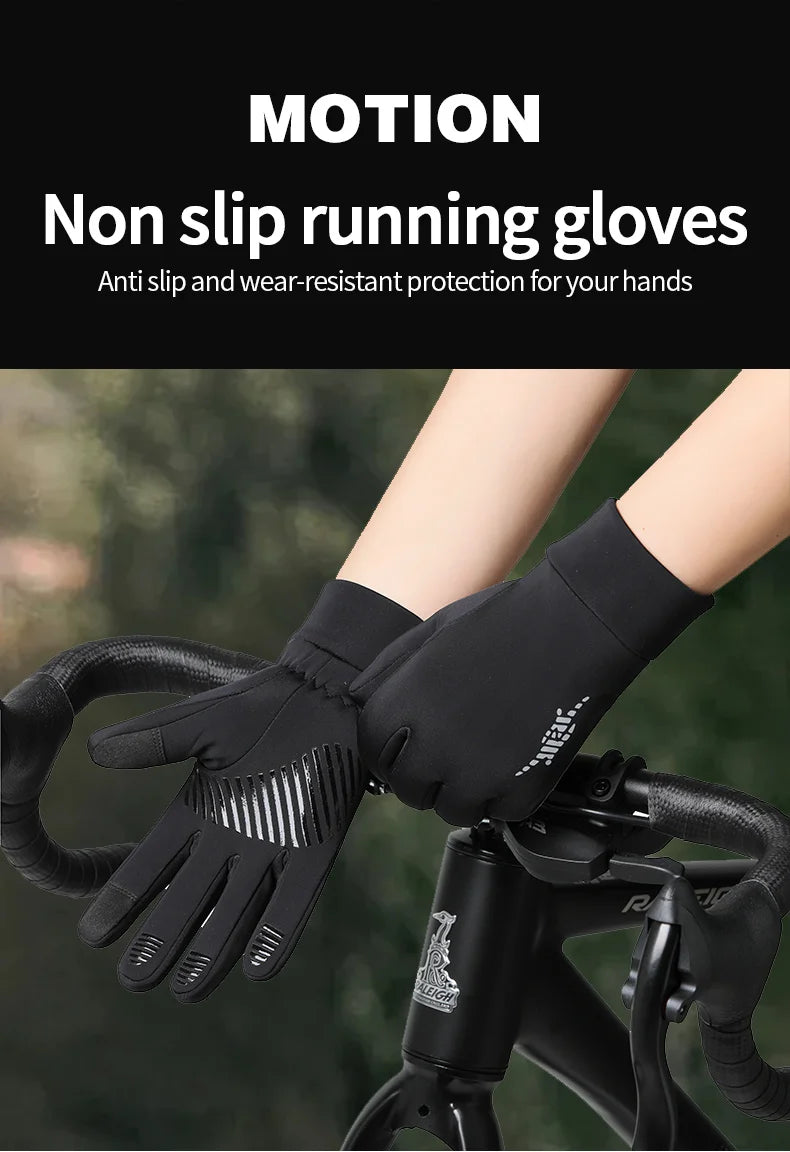 Black non-slip running gloves being worn on a bicycle handlebar.