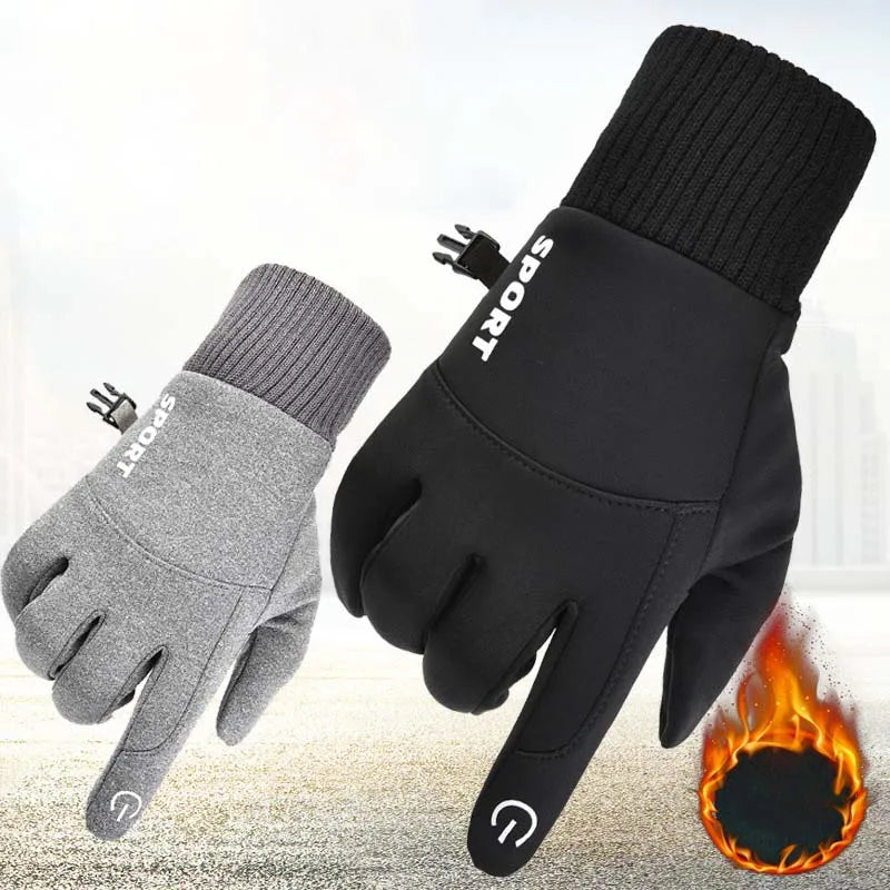 A pair of black and gray thermal fleece touchscreen gloves shown against a blurred background with a flame effect.